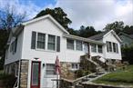 First time on market in 60 years. 2 BR 1.5 bath on main floor, Living room with Stone Fireplace, hardwood floors under laminate flooring, 2 Bedrooms with hardwood floors and full bath with walk in shower, 3 steps up to dining room , half bath and kitchen with French door out to stone and slate patio. Finished bsmt with family room, den full bath, dining area, door out to back yard, door to unfinished bsmt with newer Weil McLain 2 zone oil heat with indoor oil tank. Newer CB panel and water storage tank. Central Air and whole house Generac Generator. Terraced level yard and sloping yard with stone walls and steps. Off street parking for 3-4 cars. Optional Lake Lincolndale property owners association (LLPOA) with lake and beach access. Poss in-law set up.