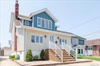 Welcome to your dream home nestled in the heart of Howard Beach. This spacious legal 2 family is currently designed as a single residence and offers endless possibilities. Featuring 4 bedrooms, 2 full modern tiled bathrooms, large living room, formal dining room and gleaming hardwood floors, it is perfect for entertaining guests. The updated kitchen is equipped with granite counters and stainless-steel appliances. Recent updates include new vinyl siding, with newer roof and windows. The home boasts a full basement with a separate outside entrance, as well as a 2-car detached garage. Enjoy year-round comfort with efficient gas heat and 2 zone central air conditioning. This home is in a prime location with access to the A train, Air Train, close to the beautiful Frank Charles Memorial Park and 10 minutes to JFK Airport and Rockaway Beach. Donâ€™t miss out on this opportunity to own this immaculate home!*Two Gas and Two Electric Meters but only 1 gas meter currently connected, as the home is being used as a single family residence.