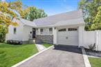 Tastefully and Fully Renovated True 4 Bedroom Expanded Ranch. All New Roof, Siding, Electric, Heating, Cooling, Windows, Baths and Kitchen w/SS Appliances. Wood Floors Throughout. Hi Hats. 2 High Efficency Cooling/Heating Systems. Huge Beautifully Finished Basement with Tiled Floors and Laundry Room. New Driveway and Patio. Private Backyard.