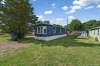 Welcome to this beautifully updated mobile home featuring an open-concept layout with plenty of natural light. The spacious living room offers large picture windows and brand-new flooring that flows seamlessly into the dining area and kitchen. The kitchen has been refreshed with white cabinetry, butcher-block style countertops, stainless steel appliances, and ample storage. Fresh paint throughout and modern finishes create a clean and inviting atmosphere. This home also includes nicely sized bedrooms with closets, updated fixtures, and move-in ready appeal. Located in a quiet community, close to local shopping, dining, and major roadways for easy commuting. A perfect option for affordable, stylish living!
