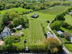 Introducing an excellent opportunity to own a historical antique farmhouse built in 1858 and owned by one of the founding families in the area. The house is set on a well-cultivated vineyard planted with premium varieties of Sauvignon Blanc, Merlot, and Riesling, situated on the North Fork of Long Island. This boutique vineyard supplies grapes to wineries and breweries, offering an addition to the world&rsquo;s finest wines and craft beverages. A preliminary site plan is available to develop a unique tasting room, enhancing the propertyâ€™s potential. The existing 1800s farmhouse, rich in character, can be integrated into your vineyard vision or removed to suit your design aspirations. A farm-sized barn/stable, equipped with electricity and water, provides further functional versatility. The rear of this property has frontage on Eugenes Rd - across the waterfront. Set on 17.5 acres of beautiful North Fork agricultural land, the property comes with Development Rights Intact, presenting the opportunity for possible subdivision (buyer to perform due diligence). Ideally located moments from town, school, beaches, shops, transportation, vineyards, and wineries, this property offers exceptional exposure and accessibility. With endless potential, do not miss out on this wonderful opportunity to participate in everything NorthFork has to offer.