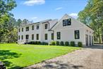 Discover the epitome of modern elegance at 95 North Summit Boulevard-a newly built architectural retreat nestled on over 2 acres of manicured, park-like grounds. This private estate offers the perfect fusion of tranquility, space, and high-end design, located just minutes from the heart of Westhampton Beach. Boasting 4, 500 square feet of thoughtfully designed living space above grade with 5 bedrooms and 5.5 bathrooms, this expansive home also features a 2, 000-square-foot unfinished basement and an additional 500-square-foot bonus area above the garage-directly accessible from the primary suite. This versatile space is ideal for a future gym, home office, or private studio. Inside, the layout has been curated for both comfort and function, featuring multiple en suite bedrooms, each with generous closet space and spa-inspired baths. The primary suite serves as a true sanctuary, complete with dual walk-in closets, a luxuriously appointed bathroom, and private access to the flexible bonus area. An open-concept main level welcomes you with a grand foyer, flowing seamlessly into spacious living and dining areas. The chef&rsquo;s kitchen is a culinary dream, outfitted with premium Bosch appliances, a Sharp microwave, and XO wine and beverage coolers. For added convenience, the home includes dual laundry stations with LG and Samsung washers and dryers on each floor. Step outside into your own resort-style backyard, featuring a heated gunite pool and surrounded by a custom mahogany deck that transitions to a generous bluestone patio. A dreamy walkway leads to the welcoming front entrance, while a pickleball sport court and three-car garage add to the impressive amenities. Located in a serene, tree-lined enclave, this property offers an unrivaled sense of privacy while remaining just a short drive from the boutiques, dining, and pristine beaches of Westhampton&rsquo;s vibrant Main Street. Experience elevated Hamptons living-where every detail is designed for luxurious comfort and effortless entertaining