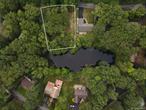 Priced to sell, water front home site! This rare opportunity in the highly desirable Emerald Green community wonâ€™t last. Pond Lane is an intimate community within Emerald Green, which is located directly on a private pond with additional access to Lake Louise Marie, a sprawling 254-acre lake perfect for swimming, kayaking, and fishing. As an Emerald Green resident, youâ€™ll enjoy two lake access points plus a wealth of amenities, including a newly renovated clubhouse, fitness center, tennis and pickleball courts, basketball courts, and year-round community activities.Known for its natural beauty, secure setting, and strong sense of neighborhood, Emerald Green offers one of the best values in Sullivan County. Whether youâ€™re looking to build a seasonal retreat or a year-round residence, this improved lot is ready for your vision. Just 12 minutes to Resorts World Catskills, 17 minutes to the Sullivan International Airport, and 26 minutes to Bethel Woods Center for the Arts, youâ€™ll be conveniently positioned just off the main highway for both relaxation and entertainment.