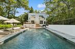 Contemporary Style with Pool & PrivacyTucked away on a private and serene 0.94 +/- acre setting, this renovated contemporary residence offers a seamless blend of style, comfort, and indoor-outdoor living in a prime Wainscott location. Spanning approximately 1, 800 square feet plus a detached garage of 650 square feet, the two-story home features 3 spacious bedrooms and 2 full bathrooms, thoughtfully updated in 2020. The sun-filled great room is the heart of the home, boasting a vaulted ceiling with skylights, a wood-burning fireplace, and an open dining area-all surrounded by glass sliders that open to a generous wraparound deck. Perfect for entertaining or relaxing, the deck includes dedicated lounge and dining spaces that overlook the heated gunite swimming pool and beautiful grounds with natural beach grasses and mature plantings. The modern kitchen is fitted with professional-grade stainless steel appliances and elegant marble countertops, ideal for both everyday living and hosting. Total expansion potential for first, second, and lower levels is 3, 900 sf and plans by architect Brian Glasser RA are included. Conveniently located with easy access to both East Hampton and Sag Harbor Villages, as well as the famed Atlantic Ocean beaches, this turnkey home offers a stylish escape in one of the Hamptons&rsquo; most desirable areas. A rare combination of privacy, design, and location.