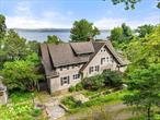 Welcome to your Private Hudson River Sanctuary! Enjoy stunning river views, timeless charm, and modern luxury! Perched above the river, this reimagined 1910 Colonial offers the perfect blend of serenity and sophistication. Whether you&rsquo;re seeking a peaceful weekend retreat, or a full-time lifestyle upgrade, this turnkey designer showpiece delivers it all, just 40 minutes from Manhattan, without the Hamptons gridlock!Thoughtfully renovated in 2020, this home masterfully preserves its historic characterâ€”coffered ceilings, wide moldings, original stone fireplace, and custom built-insâ€”while infusing every space with curated, contemporary design and upscale finishes. Nestled on 1.8 beautifully landscaped acres with stone patios, fruit trees, and fenced green spaces perfect for pets, this property feels like a secluded retreat, yet remains conveniently close to the city. Wake up to stunning river sunrises, sip your morning coffee on the expansive primary suite balcony as sailboats drift by, or meander down your private stone path to the 10-mile Esposito Trail leading to Piermont and South Nyackâ€™s shops, cafes, marinas and waterfront parks. Enjoy over 3, 300 square feet of living space (not including the partially finished attic and basement) with incredible flexibility. The main floor showcases an open-concept layout with a gracious living room, family room, dining room, and three river-facing sunrooms or offices, each bathed in natural light and perfect for remote work or creative pursuits. The chefâ€™s kitchen is a dream for entertaining, featuring marble countertops, a six-burner Viking range, and Sub-Zero refrigerator, all opening out to a sun-drenched patio with river viewsâ€”perfect for seamless indoor-outdoor gatherings. The sprawling primary suite is a retreat, with spa-like bath, custom-built closets, and direct access to a private river-facing deck to relax and unwind. Three additional bedrooms (two with built in custom beds, and two with an adjoining room with river views, perfect for a cozy flex space as a lounge/playroom or additional office complete the second floor. Upstairs, the partially finished attic offers added bonus space for movie nights, legos or gaming. The partially finished walkout lower level adds even more flexibility, with room for a gym, rec room, wine cellar, an additional guest or au pair suite, and enormous storage space. An exterior, climate-controlled bonus space offers the perfect setting for a private office, music studio, or artistâ€™s workshop. And the original Carriage-style detached two-car garage adds charm and functionality. With quick access to the MC Bridge just minutes away, and only 13 miles to the George Washington Bridge, this is a rare opportunity to own a true Hudson River havenâ€”a place to unwind, entertain, and reconnect with nature, without leaving convenience or elegance behind. This is more than a homeâ€”itâ€™s a lifestyle. Tranquil, inspiring, and completely turnkey, this one-of-a-kind property is designed for those who appreciate architectural integrity, thoughtful design, and the beauty of riverfront living.