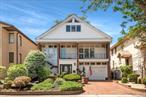 Howard Beach Waterfront Two-Family HomeThis spacious two-family home in Howard Beach blends comfort, space, and waterfront living on a 40 x 110 lot with direct Jamaica Bay access. Itâ€™s designed for both everyday relaxation and lively entertaining.The expansive backyard is an inviting retreat with sweeping bay views. Enjoy a private driveway and garage, an outdoor gas line perfect for barbecues, a private dock with two boat slips on a deep water canal, a boat lift that accommodates a 27-foot vessel, and a protective canopy to shield your boat from the elementsâ€”creating your own private waterfront haven.Inside, the main unit welcomes you with sunlit interiors and an open living space that creates a warm and inviting atmosphere. The kitchen is equipped with custom cherry cabinetry, granite countertops, a double oven, and generous storage, plus a large eat-in area with sliding doors to the backyard. Just off the kitchen, the den features hurricane windows overlooking the yard and bay, bathing the room in natural light and offering stunning water viewsâ€”a perfect spot to relax or entertain. Also on the first floor is a full bathroom and a large custom-built closet that adds both function and convenience. Comfort is provided year-round with radiant floor heating on the first level, four heating zones throughout, and central air conditioning on the first floor and in the primary bedroom.The main unitâ€™s second floor boasts an oversized primary bedroom with an en-suite bathroom, hurricane windows, and a picture window framing dramatic bay views. A sunlit and spacious secondary bedroom features a private balcony overlooking the front of the home, ample closet space, and a full bathroom nearby for convenience.On the top floor, the full finished attic offers a versatile bonus space with skylights that flood the room with natural light. It is an ideal setting for a home office, media room, fitness area, playroom, or guest suite.The second unit has a separate entrance and is a well-designed one-bedroom, one-bathroom apartment with a large window overlooking the bay. It is perfect for generating rental income.Built with sturdy cinderblock over brick construction on the first and second floors, this custom-built home comes with an elevation certificate and is built higher than neighboring houses for added peace of mind. Additional comforts include ample storage throughout and thoughtfully designed layouts for both owner and tenant.The prime Howard Beach location places you just minutes from JFK Airport, Resorts World, Rockaway Beach, Charles Park, shopping, dining, schools, and public transportation.This rare property offers not just a home, but a waterfront lifestyle of comfort, convenience, and endless possibilities on the bay.
