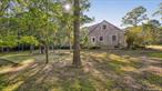 Timeless Springs CottageSet on a quiet half-acre corner lot, this classic home blends character with opportunity. Hardwood floors throughout are accented by a sunlit bay window, pine beam ceiling, and wood-burning brick fireplace anchoring&#160;&#160;the living room which is complemented by custom oak built-ins and original details throughout. The vintage kitchen has a dining/possible den just off to the side and a full bath just down the hall.&#160;&#160;Upstairs, there are three sunny bedrooms with ample sized closets, one ensuite, and a full bath. The expansive grounds offer room to expand or add a pool, while nearby hiking trails, bay beach and local restaurants complete the setting. A rare chance to create your vision!