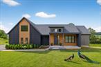 OPEN HOUSE: SAT & SUN 9/6 & 9/7 12PM - 2PM!Elevate your Horizon: Modern European Luxury New Construction in Warwick, NY.In a private enclave of just 33 homes (31 to be built), a new standard rises featuring energy-efficient systems for fossil fuel-free living. Using the latest technology for savings and comfort, this home is a story of purposeful living. Every choice supports a greener, calmer lifestyle and every room invites you to pause, reflect, and appreciate the moment. The uniqueness of this home begins with its design and layout. The overall vision is open concept living with an abundance of hidden storage for the modern-day life. The primary en-suite sits on the first floor, a private, convenient retreat that places daily comfort at the core of everyday life. On the same floor, a guest room and full bathroom welcomes visitors with ease and privacy. Two additional guest rooms and a third full bath reside on the second floor offering flexible space for family, guests, or a growing household. The walkout basement is crafted with large windows and a rear sliding door, creating a seamless threshold between indoors and outdoors, inviting generous natural light to fill the space. An enlarged covered deck extends the living area toward the horizon, providing a stage for morning coffee, afternoon sun, and evening gatherings while indulging in the mountain views. This design feature enables seasonal living and a sense of connection with the landscape. Quality, efficiency, and design are the cohesive cornerstones of this development. Custom millwork and a chefâ€™s kitchen anchor the homeâ€™s aesthetic, while a walk-in pantry and thoughtfully arranged living spaces ensure functionality. At approximately 2, 500 square feet, with four bedrooms and 3 full baths, the home is balanced for everyday life and refined entertaining, all while embracing sustainable practices andintelligent technology. The local geography and history lend depth to the homeâ€™s character. Nestled in the mountains of Orange County, Pine Island is part of the storied charm of Warwick. The setting blends a legacy of farm history and native roots with a modern, forward-looking lifestyle. Applefest, wineries, and breweries that define this charming town, eclectic shops, and a thriving farm-to-table scene anchor a community that respects its pastwhile embracing the possibilities of the future. Being a resident of Warwick allows you to enjoy a private beach at Greenwood Lake. The lake supports fishing, boating, and a diverse array of water activities, delivering substantial seasonal outdoor appeal. Additionally, the proximity of Mt. Peter Ski Area provides winter recreational fun. Warwick has become a sought-after destination for those looking to embrace a lifestyle of leisure and enjoyment.Choosing this residence means adopting a life where every element serves a purpose and every moment is crafted with intention. A place where thoughtful design meets practical comfort and fossil fuel-free efficiency sits alongside cutting-edge technology. Where the story of the land, its heritage and horizon, enriches daily living. If you are ready to live in a home that embodies the art of modern living, schedule a private tour and discover how this community redefines what a home can be.