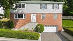 Bright and Versatile Colonial in the Award-Winning Ardsley School District! Welcome to this spacious and thoughtfully designed Colonial, ideally located just minutes from shops, dining, and everyday conveniences in the heart of the Village of Ardsley. Enjoy the comfort and flexibility of multi-level living, beginning on the entry level, which features a bright and spacious living room, a cozy family room, a generous bedroom, and a full bathroom; perfect for creating a home office, or providing private space for guests. Upstairs, the main level boasts an open sun filled kitchen that flows seamlessly into the living and dining areas, creating a warm and inviting space for everyday living and entertaining. The large primary bedroom includes an ensuite bathroom, while two additional bedrooms and a third full bathroom complete the main level. Step outside to a tiered patio, ideal for al fresco dining, outdoor gatherings, or simply relaxing. Combining functional space, a flexible layout, and an exceptional location, this home offers the best of comfort, style, and convenience. A must-see!