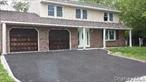 Welcome to this spacious 4 bedroom, 3.5 bathroom Splanch-style home located on a quiet residential street in Central Islip. This home offers a practical layout with tasteful updates throughout.The entry foyer leads to a bright and open living room. On the main level, you&rsquo;ll find a formal dining room and an updated kitchen featuring white shaker cabinets, modern countertops, stainless steel appliances, gas cooking, and a large center island with seating. The cozy family room, just off the kitchen, has sliding glass doors that open to the backyard great for indoor-outdoor entertaining.Upstairs, there are four generously sized bedrooms, including a large primary suite with a full bathroom, jacuzzi tub, and ample closet space. Hardwood floors run throughout the upper level, and both full bathrooms have been updated.Additional features include recessed lighting (high hats) throughout, a 3-zone gas heating system, a private PVC-fenced yard with a patio, a half basement for storage or extra space, and an attached garage.Located in the Central Islip School District, this home is move-in ready and ideal for both everyday living and entertaining.