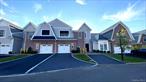 Calling all Snowbirds!! 242 Coach Drive is an exquisite 2-bedroom, 2-bathroom condo spanning 1, 100 sq. ft. in the prestigious Kensington Estates, a 24-hour gated boutique community in Woodbury NY, designed for a luxurious, low-maintenance lifestyle for residents 55 and over. This exceptional unit is one of the few benefiting from a rare tax abatement, reducing annual property taxes to under $1, 800 for an additional 7.5 years!â€”Yes, you read that correctly, under $1, 800 per year!, making this home an extraordinary value for luxury living. This single-story residence boasts 9-foot ceilings with elegant crown molding and base moldings throughout, creating a refined and spacious ambiance. Step into a bright, open concept living space with expansive windows that flood the home with natural light, seamlessly connecting the living room, dining area, and gourmet kitchen, perfect for both intimate gatherings and entertainment. Beautiful chefâ€™s kitchen, featuring a premium Wolf range, Sub-Zero refrigerator, sleek stainless-steel appliances, custom cabinetry, and stunning quartz countertops, ideal for culinary enthusiasts. The serene primary suite offers a generous walk-in closet with custom shelving and a spa-inspired en-suite bathroom adorned with upgraded Carrera marble, premium Kohler fixtures, and modern LED mirrors for a touch of luxury. The elegant second bedroom, accompanied by a full bathroom with matching Carrera marble, Kohler fixtures, and LED mirrors, provides flexibility for guests, a home office, or a cozy den. Rich, wide-plank oak flooring runs throughout, adding warmth and timeless elegance. Outside, a beautifully crafted covered Nicolock paver patio with plenty of room for furniture and a BBQ overlooks a gorgeous grassy open space with a western exposure and beautiful sunsets , creating a tranquil setting for al fresco dining or relaxation. The home is equipped with state-of-the-art systems, including a Navien tankless hot water heater, natural gas heating, central air conditioning with smart thermostats, a fire suppression sprinkler system, and an advanced alarm system for safety and comfort. A high-efficiency LG washer and dryer are tucked away in a dedicated laundry closet, and municipal sewer connections ensure hassle-free, eco-friendly living Nestled within 18 acres of impeccably landscaped grounds, Kensington Estates offers resort-like amenities, including a sparkling pool, tennis courts, a state-of-the-art fitness center, a private clubhouse for social events, and scenic walking paths around a tranquil pond. Perfectly situated near the charming villages of Cold Spring Harbor, Huntington, and Syosset, this condo provides easy access to boutique shopping, fine dining, cultural attractions and major highways, blending suburban serenity with urban convenience. Located within the renowned Syosset School District, this home offers access to top-tier education, adding to its appeal. This home is a rare opportunity, especially with its exceptionally low property taxes and turnkey condition. Don&rsquo;t wait on this one!