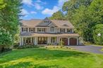 Beautiful waterfront Hampton style colonial combines elegant casual living with everyday functionality set on a quiet street with mature designer landscaping, inground pool, mooring rights and stunning views. Make this your full time residence or weekend escape! Coastal living at its finest in the Harborfields school district. This home is the envy of every entertainer with endless interior and exterior spaces designed with thoughtful flow for gathering, recreation and relaxation. The solid wood double front door opens to the gracious foyer with sweeping staircase, a powder room, custom wood flooring and fine millwork. The inviting living room features detailed molding and French doors to a covered front porch with ceiling fan. Adjacent to the living room, a large formal dining room is the perfect space to entertain, accommodating more than 12 guests. Open a second set of French doors to enjoy the breeze off the water or move outside to the rear covered gazebo, a lovely spot for a casual meal! The open concept chefâ€™s kitchen offers every imaginable culinary amenity; custom cherry cabinetry, granite counters, farm sink, Subzero full size fridge and freezer, Bosch double ovens, two dishwashers, six burner Wolf stove, center island with seating plus storage and a dining area with large windows to enjoy the waterviews along with access to the wood deck. Also open to the kitchen; the fabulous den with stone surround, woodburning fireplace and custom built-in entertainment cabinetry. Relax, entertain and enjoy more views of Centerport Harbor in the light and bright year-round sunroom, located off the den. The separate laundry room with access to the 2 car garage and pantry storage/bar sink area complete the main floor. Upstairs, a hallway leads to five bedrooms. The spacious primary suite features amazing waterviews, vaulted ceiling, French doors to a wood deck, walk-in closet with custom closet system, an additional deep closet and the updated ensuite primary bathroom with radiant heat, jetted tub, large walk-in shower and double vanity. The four remaining bedrooms are generously- sized with abundant natural light, high ceilings and ample closet space. Two bedrooms share a full bathroom with double vanity set between them. Down the hall; a fourth bedroom, hall full bathroom with tub/shower and a fifth bedroom with en suite full bath and access to the attic for storage. The full basement provides additional living space, along with outside access on both sides of the home. This lower level features a recreation room, storage space, full bath, gym area and utility room. Outside, the stunning waterviews are showcased at every tier; the wood deck and covered gazebo, the yard and garden below, the gunite heated 20x40 chlorine pool/hot tub with paver patio and seating area, plus the lower yard with beach access at the sea wall. Many updates in the last 2-3 years include: home freshly painted inside and out, new roof and gutters, updated pool equipment and hot tub plus a new hot water heater. Additional features: custom wood flooring, 200 amp electric, sea wall rebuilt in 2007, 10 zones in ground sprinklers, extensive molding work throughout, Andersen windows, gas hot air heating system, 4 zone central air conditioning, 2 car garage with driveway parking for 4 cars and more. Donâ€™t miss this truly special place to call home! Exceptionally beautiful in every season!