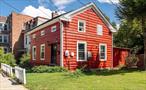 Step into timeless charm with this beautifully maintained 3-bedroom, 1.5 bath single family home in the heart of the Southside of Poughkeepsie. Built in 1850, this historic gem offers approximately 1500 sq feet of character and comfort, including stunning original wide-board hardwood floors that speak to its rich heritage. Inside, you&rsquo;ll find sunlit living spaces and a warm, inviting layout that blends classic details with everyday functionality. Natural light fills the home with warmth and highlights the great layout and lovely decor. The first floor has a family room, living room, kitchen and a room just waiting to be repurposed into an office/study or just kept as storage. Outside, a spacious two-car garage provides ample storage or workspace. The property sits on a quiet street just minutes from the train station, shops, restaurants, and the Hudson River waterfront. With its rare combination of history, charm and convenience, this home is a must-see for buyers seeking something truly special. The kitchen has great butcher block counters and a farm sink. There are solar panels and a woodburning stove which reduce the costs of utilities significantly. Upstairs there are three nice sized bedrooms and a full bath. Shopping, schools, colleges, hospitals and all features of the beautiful Hudson Valley are nearby. Don&rsquo;t miss out on this property-it is one of a kind.