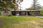 Live in & work from the same location. This fixer upper offers so much potential for the right buyer. Calling all contractors looking for a place to have their shop right on their property, this is the place. Offering 3 bedrooms, 1 1/2 bath great sized kitchen, dining room open to the living room. The breezeway leads to a covered patio then off to the large deck. The room across from the breezeway once had an amazing spa set up. Just a little muscle & sweat equity will bring this property back to life. Nestled on almost 3 acres sits the main home, a detached 2 car garage, an inground pool, a hot tub, a metal framed workshop & multiple sheds. The rear yard is fenced in but goes way beyond the fence line. The home is being sold as-is.