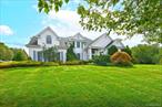 Welcome to this stately and elegant post-modern residence in the gated community of Dix Hills farms ,  This home is offering 6, 000 square feet of refined living space on one private country club acre. A grand two-story foyer with soaring 22â€™ ceilings introduces an open layout designed for both comfort and style.This impressive residence offers 6 spacious bedrooms, 4.5 baths, and a 3-car garage. En-suite guest room with full bath. The living room and family room both showcase soaring 22â€™ ceilings, while gleaming hardwood floors flow seamlessly throughout. The luxurious primary suite features a sitting area, his-and-hers closets, and a spa-inspired bath. Dual Staircase. A full finished basement .The gourmet kitchen, appointed with stainless steel appliances and granite countertops, opens effortlessly to the family room with its fireplace and dramatic ceilings, all overlooking the professionally landscaped backyard. Outdoors, a private resort-style retreat awaits with a sparkling inground Heated pool enhanced by a stone waterfall, relaxing Spa tub, elegant cabana, and a bi-leveled bluestone patioâ€”an ideal setting for gatherings or everyday enjoyment.Additional features include an electric car charger .  Close to All, Award winning Half Hollow School district.