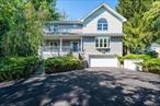 Welcome to Hastings-on-Hudson, an artful community just 20 minutes by car from Manhattan!Set majestically above the road, this graciously appointed five-bedroom home is close to town, shopping, trains, and highways. With 3, 178 sq ft and an additional approximately 755 sq ft in the finished lower level, this home features a completely remodeled chef&rsquo;s kitchen with an eat-in nook and walk-in pantry, a first-floor guest suite with full ensuite bath, stylish family room with a stone fireplace, powder room, an elegant living room with bay window, and an oversized dining room with a leaded glass chandelier. Hardwood floors throughout.New farmhouse style black framed sliders from the renovated kitchen lead to a charming flagstone patio rimmed with hydrangeas. potted flowers and a private fenced backyard featuring both a vegetable and flower garden.The second floor offers four sunlit bedrooms, all with hardwood floors, includes a primary suite with a cathedral ceiling, architectural window detail, a custom walk-in closet, and an ensuite bath. One bedroom with built-ins is currently used as an office and adjoins a large upper-level sundeck.The basement-level studio with bathroom, adjoins a two-car garage equipped with a Tesla charger.Upgrades include a new 2023 roof, new chef&rsquo;s kitchen, full house generator, new driveway, new stone pathway, newly painted rooms, new water heater, electric upgrades, fenced in yard with landscaped screening, etc. Many upgrades. Completely turnkey condition!