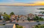 Nestled on the open bay in Baldwin, this stunning 4-bedroom, 2.5-bath home offers panoramic water views from nearly every room and breathtaking sunsets that will leave you in awe. Enjoy resort-style living with an in-ground gunite pool, an expansive paver patio featuring a built-in bar area, and even a sandy section perfect for relaxing with your toes in the sand, entertaining or building sandcastles. The beautifully updated eat-in kitchen showcases imported Italian cabinetry, stainless steel appliances, and gas cooking. The spacious layout provides ample room for extended family, and recent updates include new central air, fresh paint, a brand-new full bath, new LED recessed lighting, and gleaming hardwood floors. Additional features include gas heat, a cozy gas fireplace, a circular paver driveway and updated 200 AMP electric. New bulkhead, pilings, aluminum ramp and float for swimming, pulling up boats/jetskis was installed approx 2021. Approximate taxes are only $16, 832 with basic STAR. Located in Flood Zone X, flood insurance is not required, but a transferable policy is available for just $1, 400 per year. Imagine this paradise in your own backyard!! (Some pictures have been virtually staged)