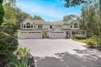 Diamond Dream Home in Manorville â€“ In ground , heated, saltwater pool, 5 car garage, bonus room and basement! A Rare Gem! Tucked away at the end of a peaceful cul-de-sac on a shy 2-acre lot, this 4â€“6 bedroom showstopper is the perfect blend of luxury, comfort, and space. From the moment you arrive, the wrap-around porch and meticulously maintained grounds set the tone for what awaits inside. Step through the main entry and be captivated by hand-scraped wood flooring throughout and a layout designed for both grand entertaining and everyday living. The formal living and dining rooms lead to a gourmet chefâ€™s kitchen, equipped with a 6-burner professional stove with griddle, pot filler, granite countertops, and a peninsula â€” plus an eating area overlooking the expansive yard. The cozy family room features soaring ceilings and a wood-burning fireplace, creating the perfect space to relax. A private main-floor laundry room with wainscoting adds charm and convenience. Upstairs, retreat to a lavish primary suite with vaulted ceilings, three closets, and a fully renovated spa-like bath complete with dual sinks, clawfoot tub, walk-in shower, and illuminated mirrors. Additional bedrooms offer special touches: Bedroom 2 includes a custom Murphy bed, Bedroom 3 has dual closets and its own private bath, and Bedroom 4 is ideal as a guest room or home office. Need even more space? The massive recreation room over the garage boasts soaring ceilings and is perfect for a pool table, home theater, or multi-use lounge. The full basement with separate entrance is a must-see, offering endless possibilities to suit your lifestyle. Outside, your private oasis awaits with a heated saltwater in-ground pool featuring a newer liner and Loop Loc cover, paver patio with awning, and vibrant perennial gardens. Car enthusiasts will love the 5-car garage with electric garage door openers, and the home is equipped with all the extras: CAC with newer condensers, whole house generator, 500-gallon propane tank, upgraded electric, pull-down attic stairs for extra storage, and 8-zone sprinkler system. Centrally located with easy access to the LIE and Sunrise Highway, just minutes from Hampton beaches, renowned wineries, breweries, shops, and restaurants. This home is not just a residenceâ€”itâ€™s a lifestyle retreat with room for everyone, including extended family. Truly a must-see diamond that checks every box!