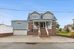 Two-Family Brick 60 x 100 Corner Lot Turn-Key InvestmentFully detached -2 family brick home on an oversized 60 x 100 lot in the heart of Old Howard Beach. This meticulously maintained property features two legal units and a finished basement, offering a rare opportunity for investors or end-users seeking income-producing potential with excellent long-term upside.Unit 1 (1st Floor): 3 BR / 2 Bath - Renovated with open-concept living/dining, beautiful coffered ceilings, fireplace, hardwood floors, and gourmet kitchen. Direct access to private backyard with saltwater in-ground pool,  hot tub, and deck.Unit 2 (2nd Floor):2 BR / 1 Bath - Bright and spacious layout, generous living space.Walk in Finished Basement: 2 beds / 1 bath storage, utilities, and shared laundry area.Gargage & Private driveway with parking for multiple vehicles.Updated mechanicals, separate entrances for each unit, and strong rental history.Located on a quiet residential block, across from Frank M. Charles Memorial Park, with easy access to Q11 bus,  A Train,  JFK Airport, shopping, schools, and beaches. Great for 1031 exchange, owner-occupant + rental income.