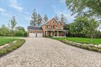 Welcome to this luxurious new construction in the heart of South Jamesport, just half a mile from the beach and 200 yards from deep-water marina.  Located in an exceptional neighborhood, this beautifully crafted home features 3 spacious bedrooms and 2.5 elegant bathrooms, including a stunning primary ensuite with a marble bathroom, double vanity, and large custom closets. Designed with an open-concept layout, the entire home boasts 7-inch wide oak wood floors, a cozy gas fireplace, and a gourmet kitchen equipped with premium Thermador appliances. The full basement, with 9-foot ceilings and two egress windows, offers the potential to add up to two additional bedrooms-perfectly aligned with the septic system already approved for five bedrooms. Step outside to enjoy a 16x32 heated inground gunite saltwater pool, surrounded by professional landscaping, landscape lighting, and an irrigation system. A charming front porch with a tropical wood deck completes this exceptional offering, blending refined interior design with resort-style outdoor living.