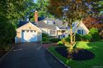 Located on Floral Parkâ€™s picturesque Oak Street, this beautiful 2100sqft. expanded cape offers 4 spacious bedrooms & 2.5 baths on an 8, 000sft. Lot. With hardwood floors throughout, this inviting home blends timeless architecture with perfect updates, expansive room sizes, high ceilings, and original designs that have details that speak to its historic character. From the attractive curb appeal with the meticulously landscaped front yard and welcoming entryway, it truly sets the tone for a home filled with warmth, comfort, and attention to detail. The home showcases exquisite millwork and custom built-ins throughout. The bright living room with fireplace offers an attractive bay window leading to dining room with another stunning picture window. The updated eat-in-kitchen offers exposed brick and yard access. The family room has cathedral ceilings, garage access and French doors leading to lovely brick patio and back yardâ€”perfect for both everyday living and entertaining. The spacious first floor primary suite includes full primary bathroom, three generous sized closets, and a serene, private feel. An additional bedroom/den completes the first floor with powder room/ensuite. The second floor offers two more generous sized bedrooms and full hallway bathroom. Additional highlights include full unfinished basement w/ walk out egress, attached garage, in-ground sprinklers. Conveniently located near schools, shops, parks, and the LIRR, this home has been lovingly maintained and thoughtfully updatedâ€”allowing you to move in and enjoy from day one.
