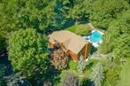 MONTEBELLOâ€”A MUST-SEE RESIDENCE! Perfectly nestled on one of the most magnificent private properties, this breathtaking home showcases a fenced-in resort-style gunite pool with cascading waterfall, hot tub, expansive lawns, and captivating views and access to the stunning Mahwah River. A beautiful paver walkway introduces stunning curb appeal, leading to a dramatic double-story entry that opens to elegant living and dining rooms enhanced with custom built-insâ€”ideal for entertaining. The state-of-the-art eat-in kitchen is a chefâ€™s dream, boasting granite countertops, center island, stainless steel appliances, and seamless flow into a warm family room with fireplace and additional built-ins. The main level also features a private bedroom with full bath, an office, and a convenient powder room. Upstairs reveals four generously sized bedrooms with abundant closets, including a primary suite with tray ceiling, luxurious walk-in closet, and spa-like bath with cathedral ceiling and freestanding jetted tub. The finished basement expands the living space with a bedroom, bathroom, family room, and direct access to the three-car garage. Recent updates include a brand-new pool cover and heater, a one-year-old hot water heater, aprx four year old roof and more. This exceptional property, combining elegance, comfort, and privacy, is truly one-of-a-kind and will not last!