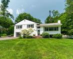 Beautiful home on .83 acre of majestically landscaped Property. Home offers Kitchen/ Dining room combo, living room, primary Bedroom with Ensuite bathBedroom, Bedroom Hall bath. Lower level offers family room with gas fireplace and bar great for entertaining, bathroom, laundry and access to two car garage. The exterior white brick with black trim is consistent with the modern style of today. Parking for 4 to 6 cars in driveway. New HVAC, new septic, new electrical.easy commute to New York City, close to train and major routes, shops and restaurants. (Owner has to relocate near family and will entertain all offers.)