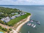 Fully remodeled condo in the sought-after Cleves Point Club & Marina community of East Marion. Thoughtfully designed to maximize flow and highlight the stunning water views, this home features stylish, up-to-date renovations throughout. Primary ensuite bedroom with waterside deck and ample closet space. There is a loft for an additional bedroom and bath if needed. Home also includes a full basement and 2 washers and 2 dryers (upstairs and downstairs). Living room with sliders to back deck overlooking the water and marina. Other features include, full wet bar with a wine fridge, separate sink and, an ice maker. Not a single detail was missed while renovating the home. The community offers resort-like amenities, including tennis courts, a pickleball court, pool, fitness center, and private docking for boats. Just moments away from the charming village of Greenport, you&rsquo;ll enjoy easy access to boutique shopping, world-class dining, and vibrant local culture. This is more than a home-it&rsquo;s a lifestyle. Whether as a full-time residence or a North Fork retreat, this property delivers the perfect balance of luxury, convenience, and coastal charm.