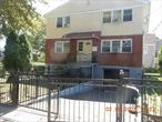 Spacious 2- Family 3/3/Basement sitting corner lot with additional space. First floor boasts 3 bedrooms, Dining area, living room and full bath, leads to finished basement with full bath and family room and summer kitchen. Second floor -3-bedroom, Dining area, large living room full bath, kitchen