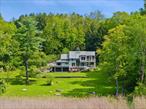 Tamoset. A truly magical setting overlooking a scenic pond. Long drive to peaceful privacy. Six spectacular acres with rolling lawns, old stone walls, ornamental trees and perennial gardens. Sophisticated Country House originally built in the 1930â€™s. Spectacular renovation with airy loft-like spaces. Sun-filled rooms with vaulted ceilings, random-width pine floors and custom lighting. Walls of windows capture natural light and scenic views. Dramatic Great Room with floor-to-ceiling stone fireplace. Dining Area with doors to two decks with a fabulous water view. Gourmet Kitchen with custom backlit cabinetry, granite and stainless countertops and professional appliances. First floor Primary Suite with door to private terraced garden. Two additional Bedrooms, one with loft sleeping area. Guest Room with Bath and doors to Screened Porch and two sun decks. Lower Level with pine-paneled Family Room, Sauna, and Wine Cellar. Covered porch with automatic screens, cold plunge tub, and hot tub. Covered Lap Pool with swim jet and automatic phantom screens. Detached Outbuilding with Gaming/Media Room and Gym. Fabulous location just moments from the apple orchards. Truly remarkable!