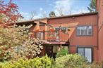 Sophisticated, two-bedroom / two-bathroom, plus den, Condo located in the pet-friendly Edgemont at Tarrytown community. Simply WOW, as you enter this single-level end unit, with hardwood floors throughout, custom built-ins, renovated bathrooms, new mechanicals, custom remote blinds, and more! The main living area offers an open floorplan that seamlessly connects the Dine-in Kitchen, formal Dining Area, and Living Room with direct access to your private West facing deck overlooking a beautiful cherry tree. The Kitchen offers custom cabinetry, granite countertops, and a large pantry. Off the entryway, and through the pocket door, is a private Den - the perfect spot for guest quarters, home office, or TV room. Down the hallway to the bedroom wing, you will find the Primary Ensuite Bedroom with a large walk-in closet and a newly renovated bathroom with a double-vanity, a large second bedroom with double closets, an updated full hall-bathroom with a console sink, and in-unit laundry. There is also direct access to a large private attic space which is insulated and partially floored. This sundrenched top floor home has Eastern and Western exposures and is flooded with natural light from dawn to dusk! With -40% less taxes (vs. Single-family property class ownership), and without the exterior maintenance, settle here soon for carefree living and enjoy all the community and area has to offer! The Edgemont offers a clubhouse, pool, tennis court, and fitness center providing its residents with plenty to do. OR head to Tarrytown&rsquo;s vibrant Main St. (less than 1 mile) for a diverse selection of restaurants, shops, music venues, and more. The waterfront is bustling with activity from Summer Jazz concerts to the Scenic Hudson RiverWalk, to marinas and greenspace. This location is also prime for commuting with easy access to local highways, the Mario M. Cuomo Bridge, and the Metro-North Train. Taxes listed do not include the NYS STAR Tax savings of $1, 477.