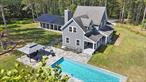 Perched sky-high above Callicoon, this contemporary farmhouse blends an aesthetic quality of life with gorgeous views and total seclusion. Drive up the long, private road into your sun-drenched 8-acre compound and nestle into the beauty of the Upper Delaware River Valley. The surrounding woods provide privacy, while the manicured yard is level and open. A bluestone patio with gazebo surrounds a sparkling salt-water pool, and a covered walkway leads to the two-car garage. The home itself is solidly built and immaculately maintained. The kitchen features quartz counters, a propane cooktop, a wine cooler and lots of light. Dining area is close at hand, and French doors open to a covered porch. Indoor-outdoor entertaining is easy. The comfortable living room has a wood-burning fireplace. Powder room and laundry are down the hall. Upstairs youâ€™ll find a primary bedroom with ensuite bath, two guest rooms (one currently used as a library), and another full bath. The full basement is dry. Other amenities include a standby generator, high-speed internet, UV water filter, radon remediation system, and security alarm. Heat is oil-fired baseboard hot water, and AC is via mini-splits. The dead-end road is privately maintained, with costs shared by three parties. When you&rsquo;re ready for Callicoon&rsquo;s restaurants, farmers&rsquo; market, and enjoying the Delaware River, just roll down the hill!