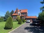 Back On The Market. Fantastic one family located in the Great Enclave of Malba Queens, New York. This exquisite breathtaking Tudor perfectly captures the timeless elegance and charm of this highly attractive family neighborhood. This unique beauty boasts, the formal living room, with its cozy fireplace, adds character and style with Adjacent to the formal dining room, and kitchen spacious for family entertaining. Upstairs, the master bedroom is a true beauty with comfy feeling, featuring a spacious private balcony-ideal for enjoying peaceful mornings and suntanning. The master bath offers luxury with jacuzzi and shower, while the second bedroom impresses with ample space and large closets. The third level offering two additional bedrooms and another full bathroom, perfect for guess or extended family. The lower-level extended space for kids play dates or mancave complete with the cozy ambiance of another fireplace and wet bar. Altogether charming this Malba gem is the perfect home for raising a lovely happy family. The outside is aligned with beautiful palm trees surrounding the property creating privacy and beauty, a lond driveway for lots parking. Close to transportation, restaurants, water and private beach area, shopping and access to the city and highways. Private dock for boats or scooters and much more. A must view...