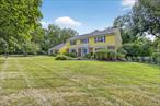 One of the most desirable addresses in Somers with a spectacular setting surrounded by estate properties both new and old. This classic center hall colonial home w/portico front entry has a superb floorplan with spacious rooms throughout, including a large office w/picture window, huge family room w/brick fireplace and French glass doors out to stone patio overlooking tranquil back yard. Conveniently located near the charming Village of Katonah with an array of shops, cafes and restaurants and equal distant to major shopping centers of Yorktown Heights. This is the first time on market since purchased by original owners. Awaiting new buyers to update & refresh this solid well built and lovingly cared for home. The possibilities are endless. Sizable primary bedroom with his & hers closets, dressing area, and a luxurious, step back into time, primary bathroom. One of 4 bedrooms has been converted to a full dressing room w/built in cabinets & display shelving for shoes & accessories, hanging wardrobe cabinets & overhead lighting. Many of the mechanicals have been recently replaced and/or upgraded including well water filtering system, ultraviolet light system, new hot water heater and (2) A/C compressors replace within past 5 years. Plenty of attic storage both above main house and separate access to garage attic. Central vacuum, irrigation sprinklers around house perimeter, and new refrigerator & wall ovens, Bosch diswasher & cooktop. Double steel door walk-out basement direct to yard with no steps. Never been walked on hardwood flooring exists under most carpeting except entrance foyer, kitchen and hallway to back door.