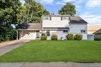 Donâ€™t miss this exceptional opportunity to own a beautifully renovated 4 (could be 5) bedroom home nestled in a Levittown neighborhood. Step into the welcoming front foyer featuring a spacious eat-in kitchen. The spacious grand living room with a wood burning fireplace creates an open, airy atmosphere ideal for both relaxing and entertaining. The main floor includes a generously sized primary en suite. Upstairs, youâ€™ll find three additional spacious bedrooms and a full bathroom that could easily be reconfigured to create another primary suite. The house comes with an enormous garage with a window and door that leads to the backyard. Other highlights include a brand new boiler & above ground oil tank and much more. This house is a perfect blend of charm and contemporary convenience.
