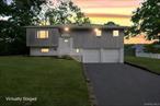 Welcome to this beautifully renovated high ranch tucked away on a quiet cul-de-sac in the heart of Smithtown. This desirable home features 4 spacious bedrooms and 1.5 bathrooms, along with a convenient two-car garage. Enjoy the modern updates throughout, including central air and heating for year-round comfort. The property is surrounded by gorgeous landscaping, creating a private and serene setting. With its isolated location and peaceful surroundings, this home offers the perfect balance of privacy and convenienceâ€”an exceptional opportunity not to be missed!