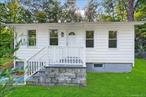 Completely updated two bedroom cottage with eat-in-kitchen, large yard, full basement, and new septic system. New stove coming soon.Walk to Deli and ice cream