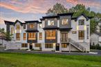Oversized & Ultra-Luxurious! Welcome to 40 Singer, a stunning 9-bedroom, 7-bathroom, 4, 959 sq. ft. masterpiece tucked away on a quiet cul-de-sac yet steps from the heart of a vibrant and growing community. Designed with elegance and functionality in mind, every detail of this home was built to perfection. Enter through the breathtaking 3-story foyer, an architectural showpiece filled with natural light from massive oversized windows â€” a rare feature in any home. The main level boasts 10-foot ceilings, custom moldings, and 8-foot doors, giving an airy, grand feel. To the right, a modern dining room flows seamlessly into the spacious living area. Across the hall sits a private study and a stylish powder room with a designer vanity. The chefâ€™s kitchen is truly a dream â€” featuring high-end appliances, quartz countertops, custom cabinetry, and an oversized island â€” opening into the playroom with generous closet space and access to the porch, creating the perfect hub for everyday living and entertaining. Upstairs, the sunlit landing leads to the primary suite, complete with a walk-in closet and spa-like bathroom with soaking tub, glass-enclosed shower, and a custom designer vanity with full-height artisan tile that creates a dramatic, high-end look. This level also includes an additional en-suite bedroom with private bath, three more well-proportioned bedrooms, a full hallway bath, and a large laundry room with storage. The finished lower level is an incredible bonus, offering a private guest suite with one bedroom and one bathroom, PLUS a 3-bedroom, 2-bath in-law suite with its own full kitchen, dining room, and spacious living area â€” ideal for extended family, guests, or flexible use. This home is drenched in natural light, professionally landscaped, and finished with custom closets, moldings throughout, and a serene, private location. 10-ft ceilings on the main level, 9-ft on the upper floor, and luxury finishes in every corner make this a truly exceptional offering.