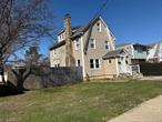 This centrally located two-family home is an excellent opportunity for investors or owner-occupants. The first-floor apartment is newly updated, featuring 1 bedroom, a brand-new kitchen, modern bathroom, refinished hardwood floors, and a private entrance. The upper apartment offers 3 bedrooms, 1 full bath, a living room, and an eat-in kitchen. The property also includes a huge 550 SQ FT detached 2-car garage and a very large yard, adding both functionality and value. Convenient access to the parkway makes this home a smart choice for those seeking rental income, long-term investment, or flexible living options.