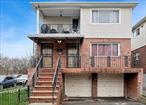 Unparalleled Quality & Elegance converge at this site. Nestled within the prestigious enclave of Flushing, this extraordinary Corner Custom Built 3900+ SF Two Family Brick Home is located on one of the towns&rsquo; prettiest streets directly across from Kissena Park & within 45 minutes of Manhattan! Come bear witness to this beautiful home with multiple desirable layouts for 2/3 families to enjoy, in addition to a fully enclosed sunroom, spacious two car garage, double driveway, 80+ SF shed & a fully fenced in yard allowing for those summer barbecue gatherings! 1st Level: This entry leads to a large living room/ dining room setting adjoined by a long kitchen with a conveniently placed washer. Moving beyond the living/ dining room is a neatly placed bathroom located directly across from a large bedroom with a wall of closets. Off to the side is the smartly positioned mechanical room & along the hallway leading to the garage setting, you will find a conveniently placed dryer. All this is complimented by your private attached two car garage at the far front. 2nd Level: You&rsquo;re welcomed into a large front balcony area before accessing the unit itself. Upon entering, there is a large living room which connects to the formal dining area adjacent to a wonderfully finished kitchen with plenty of cabinet space! Leading you into the sleeping quarters, you will find a common hall bathroom across from two spacious bedrooms & an equally spacious master bedroom with one WIC & a second large closet complimented by a conveniently located half bath. 3rd Level: You&rsquo;re further welcomed into your private abode through a grand living room with a private balcony. On the far side you adjoin a large dining area adjacent to a wonderfully appointed kitchen. Leading you into the sleeping quarters you will find a common hall bath across from two spacious bedrooms & a spacious master bedroom with WIC & another large closet & conveniently placed half bath with the room to make it into a full bath. This extraordinary home offers a mix of vintage charm & modern amenities, lending itself to elegant formal entertaining, as well as casual, comfortable family living! Don&rsquo;t miss out on living in the castle you&rsquo;ve always longed for!! and this time, with rental income to cover your expenses!!Two Car Wide DrivewayGarage ParkingHardwood FloorsLaundryPrivately Fenced In YardCorner Location