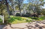 A rare opportunity to own a 1+ acre waterfront property on Great Patchogue Lake, offering 200 feet of private water frontage and sweeping year-round views. Ideally situated south of Sunrise Highway in Patchogue Village, this expansive residence has been cherished for many years.The home features five bedrooms and four and a half bathrooms, including a spacious first-floor primary suite complete with a large walk-in closet with custom built-ins and an en-suite bath. A bright four-seasons den/sunroom on the main level provides a seamless connection to the outdoors. The main level also includes a large formal living room with water views framed by expansive glass windows, as well as a formal dining room that flows directly into the kitchen, creating an ideal layout for gatherings. Three additional bedrooms on the second level provide ample accommodations for family and guests as well as two full baths. The lower level offers a separate exterior entrance, a wood-burning fireplace, bedroom, full bath and versatile living space suitable for recreation, a home office, or extended living. Generously proportioned principal rooms capture the natural beauty of the lakefront setting, while the propertyâ€™s size ensures both privacy and potential for future updates. Located less than a mile from the heart of Patchogue Village and within close reach of major roadways, shopping, and transportation, this property presents a unique blend of convenience, space, and waterfront living. Will not last!