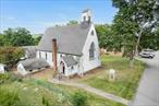 You do not want to miss this rare opportunity to convert this charming church into the home of your dreams! This mid 1800s Gothic Revival style church is nestled in the historic hamlet of Chelsea, located in Wappingers - a stone&rsquo;s throw to the Hudson River. As you walk in the beautiful double doors, you will notice the natural light beaming through the original stained glass windows along with the architectural character, there is endless potential. The main level features an over 1500 sq ft open sanctuary with 10 original pews, a traditional and original chancel and over 20 foot high ceilings making it perfect for an open floor plan and potential second level. The balcony overlooks this large room making it ideal for creating a loft-style living area. The lower level of over 900 sq ft offers a large recreational room, kitchen, utilities/storage and a bathroom, providing the foundational elements for a thoughtful residential layout. Enjoy river views, ample street parking, and quick access to major highways, minutes to the train and Beacon Art District. This is perfect for commuters looking for a peaceful retreat within reach of NYC. FYI - 9 & 11 Liberty St are included in this sale - Both the Church building and the large vacant lot to the right.