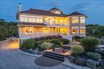 Quintessential North Fork Beach House!! Perched high above with breathtaking views of the Long Island Sound, this stunning custom-built home offers the perfect blend of luxury, comfort, and location. Just across the street from the shores of Kenneyâ€™s Beach, this 2009-built residence features 5 spacious bedrooms and 3.5 beautifully appointed baths, including a serene first-floor primary suite. Set on nearly a full acre, the property is an entertainerâ€™s dream with a heated saltwater pool, outdoor shower, and a screened-in porch ideal for summer evenings. The home also boasts a 3-car garage, whole-house sound system, security system, elevator, and a full irrigation system that keeps the grounds lush and green. Gorgeous landscaping with landscape lighting throughout. High-end construction materials and thoughtful design elevate the entire living experience, with 8-foot ceilings in the basement offering the perfect opportunity to create a media room or home gym. Enjoy spectacular sunsets, unbeatable beach access, and the potential to easily add a pool houseâ€”water and electric are already in place. This is coastal living at its finest.