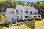 With scenic vistas and natural stone formations all around you, 56 Mulligan offers an incredibly serene setting and seasonal river views! This is the final home to be had in this gorgeous four home subdivision on a cul-de-sac and in the Irvington School Districtâ€¦.so do not miss your last chance! Boasting over 5600 square feet of beautifully crafted interior space, the home feature 5 bedrooms, 4.5 bathrooms and a tremendous sun-filled bonus room over the garage. The grand foyer welcomes you upon entry and natural sunlight highlights the natural 4â€ oak hardwood throughout. An open-concept first floor features a masterfully designed kitchen equipped with professional-grade Viking appliances, an oversized center island, and quartz countertops. The main level also includes a versatile 5th bedroom ensuite and butlerâ€™s pantry with wine refrigerator. Upstairs, you&rsquo;ll find four additional bedrooms, three additional bathrooms, laundry, and a bonus room with lovely architectural details and river views. The primary suite offers a luxurious retreat with a soaking tub, a shower with body sprays, a dual vanity with smart mirrors, radiant heating, and two walk-in closets. The unfinished walkout basement, with plumbing for a future bathroom, adds over 2, 500 square feet of potential space with great ceiling height. Exterior features include Hardiplank siding with board and batten accents, black window frames, a two-car garage with ample height for car lifts for enthusiasts, a covered front slate patio, a rear paver patio, and a lawn sprinkler system. Interior amenities comprise LED lighting, a security system, a gas fireplace, central vacuum, a fire suppression system, custom wood trim detail, pre-wired Cat-5, and spray foam insulation for maximum efficiency. The home is set in a vibrant community rich in historic charm, and close to New York City. Municipal water, sewer, and natural gas add to the convenience.