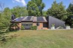 Nestled at the top of a private cul-de-sac, this fully renovated, move-in-ready contemporary home offers the perfect balance of sophistication and comfort. Set on 1.26 acres. Over 5, 100 Square Feet - With 3, 137 sq. ft. of beautifully finished living space plus an additional 2, 000 sq. ft. in the full unfinished basement, this home provides both style and future flexibility. A welcoming foyer opens to a dramatic living room with a 22-ft ceiling and floor-to-ceiling windows overlooking the backyard, and a spacious dining room that makes entertaining effortless. The custom-designed kitchen is a chefâ€™s delight featuring a wall of Anderson casement windows with transoms that capture front yard and cul-de-sac views, and a built-in window bench with hidden storage below. The space includes a large granite island with seating, stainless steel appliances, solid wood cabinetry, and mother-of-pearl tile backsplash. The kitchen is open to the family room which boasts a soaring 17-ft ceiling, a striking natural stone feature wall, and wood-burning fireplace. Upstairs, the primary suite offers an exclusive retreat with vaulted ceilings, French doors opening to a private balcony, 2 his/her master closets, and access to a private loft overlooking the living room offering stunning views of the backyard. The luxurious primary bath includes a freestanding soaking tub, dual-head shower, double-sink vanity, Bluetooth speaker, and elegant tile finishes. Three additional bedrooms feature thoughtful upgrades such as custom bookshelves, closet organizers, heated flooring, and double closets. The second full bathroom blends style and function with shiplap accents, decorative tile, and Bluetooth speaker. The homeâ€™s outdoor living spaces are designed for year-round enjoyment. A deck includes a custom fire pit, granite bar top, built-in grill hookup. A separate stone patio with wood-burning fire pit and a custom golf practice area with target and protective netting add unique recreational appeal. Additional amenities include a main-level laundry with cabinetry and slop sink, an attached two-car garage with bonus second refrigerator, luxury vinyl and hardwood flooring, and abundant storage. The property delivers privacy and serenity while maintaining easy access to premier shopping, dining, entertainment, and major commuter routes including the Palisades Interstate Parkway and New York State Thruway. Less than 20 minutes to the NJ border. Thoughtfully updated throughout, this home is ready for its next chapter.