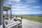 Experience the ultimate in North Fork waterfront living at this captivating 4-bedroom, 3-bathroom retreat on the Peconic Bay. Featured in The New York Times and Rue Magazine, this home was designed by the renowned firm Hyphen & Co. with the vision of making every day feel like a vacation. Set on prime private bay frontage, the residence was thoughtfully crafted to maximize water views from nearly every room. The open-concept main level is the heart of the home, with a modern chefâ€™s kitchen featuring stainless steel appliances, sleek white cabinetry, light countertops, and a spacious island that doubles as a breakfast bar. The adjoining dining area and sun-filled living room create an effortless flow, with large windows and sliders that frame sweeping vistas across the bay to Robins Island, Southampton, and the Shinnecock Canal.The primary suite is a true sanctuary with its own balcony overlooking the waterâ€”perfect for sunrise coffee or sunset cocktails. Three additional bedrooms and two well-appointed baths provide plenty of space for family and guests. Each detail, from the wood-finished floors to the custom fixtures, reflects a balance of elegance and comfort. Step outside to an expansive waterside deck designed for unforgettable entertaining, from al fresco dining to nights by the fire pit. With direct access to the bay, enjoy swimming, kayaking, paddleboarding, boating, and fishing just steps from your door. Located minutes from Love Lane, Strongâ€™s Marina, vineyards, farm stands, and fine dining, this property offers the best of North Fork lifestyleâ€”charm, convenience, and unmatched natural beauty. Furnishings included in the sale.