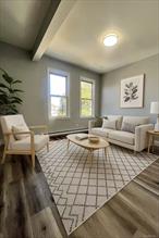 Spacious two-bedroom, one-bathroom apartment available for immediate occupancy. This residence boasts tiled floors, stainless steel appliances, microwave, quiet-close cabinets, an updated bathroom, and an eat-in kitchen. Third-floor walk-up. Please call to schedule a viewing and to apply .