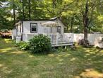 Want a comfortable summer/weekend getaway? Then check out this 3-season cottage, managed from April 15- October 15 in the Mohegan Lake area in a 40-unit community sharing 8 meticulously landscaped acres. Enter through the front lawn of this private corner unit onto an oversized Trex style deck and into the main living area. The interior of the home begins with a kitchen space and separate dining room allowing for an easy flow between interior and exterior spaces, an ideal layout to entertain guests.  A very large living room sits in the center of the home for ease of access or if your guests decide to spend the night or a long weekend of fun!  Living space is completed by 1 private bedroom in the rear of the home and a full bath with tub. House will come fully furnished as seen in the pictures so all you have to do is move right in. Community amenities including a very large community pool which is a stone&rsquo;s throw from the cabin, laundry facility, onsite parking and 2 community buildings with pool table, ping pong, exercise equipment and more. 45 minute drive from NYC and only 10 minutes from Metro-North as per google maps make this an ideal commuter location.