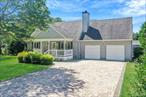 Welcome to 8 Paynes Lane, East Quogue! Indulge in this charming Cape Cod style retreat in the heart of East Quogue, offering the perfect seasonal rental opportunity for those seeking comfort, convenience, and a true Hamptons lifestyle. This beautifully maintained home features four bedrooms and three full baths across nearly 1, 800 square feet, blending classic character with modern updates. The open floor plan allows natural light to flow through the living and dining spaces, while the eat-in kitchen with granite countertops, a center island, and hardwood floors provides the ideal setting for entertaining or casual family meals. A first-floor bedroom and full bath add accessibility and ease for guests, while recessed lighting, ceiling fans, walk-in closets, and natural wood details enhance the homeâ€™s warm and inviting feel. Step outside to a private backyard oasis complete with a pool, spacious deck, and covered porch, perfect for sunny afternoons, al fresco dining, or simply relaxing with friends and family. The property includes covered parking for two vehicles and is equipped with oil heat and ductless cooling to ensure year-round comfort. Located in a quiet yet convenient neighborhood, the home is just minutes from local shops, dining, pristine beaches, and all the charm that East Quogue and the surrounding Hamptons communities are known for. This fully equipped and turnkey rental makes for an ideal coastal escape for all of the comfort and pleasure you seek in The Hamptons.