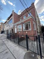 2-family property with great potential. Home needs TLC throughout but offers spacious layouts. Convenient location near transportation, shopping, and schools